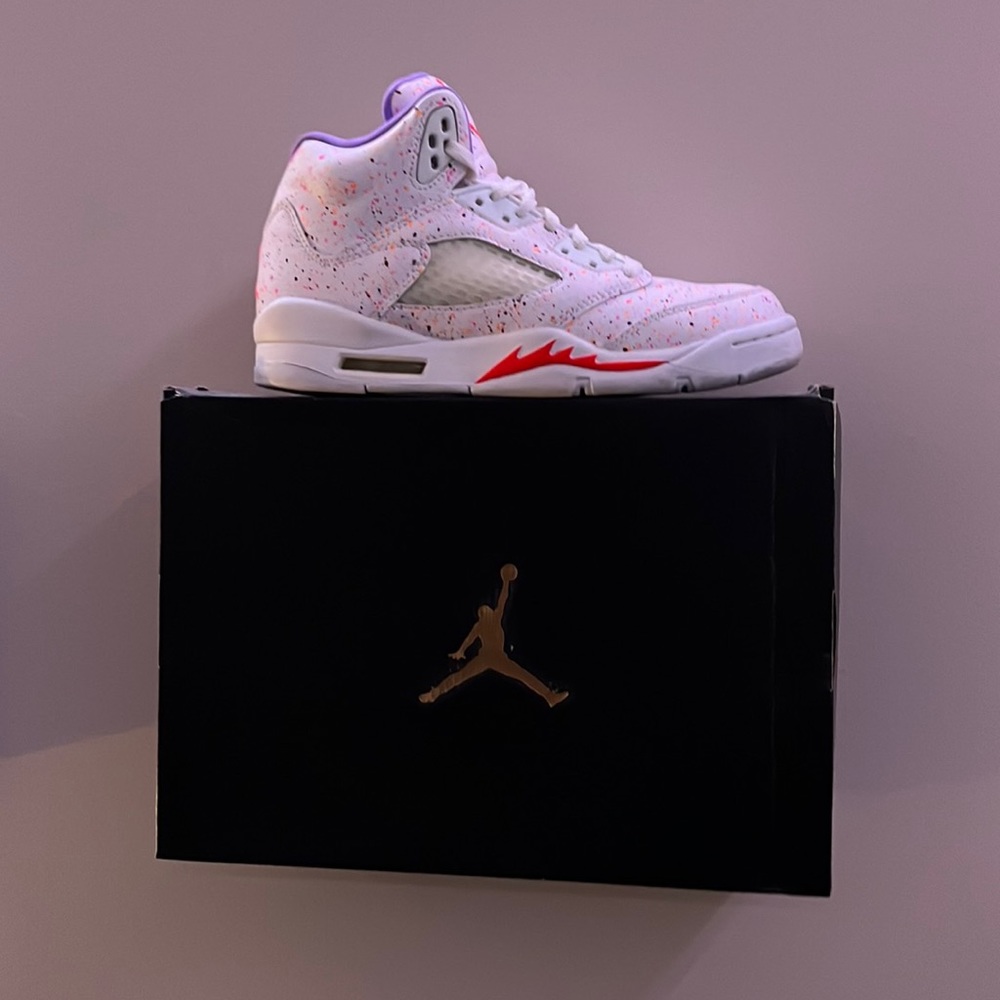 Jordan 5s with neon pink and orange dots with a purple inside.